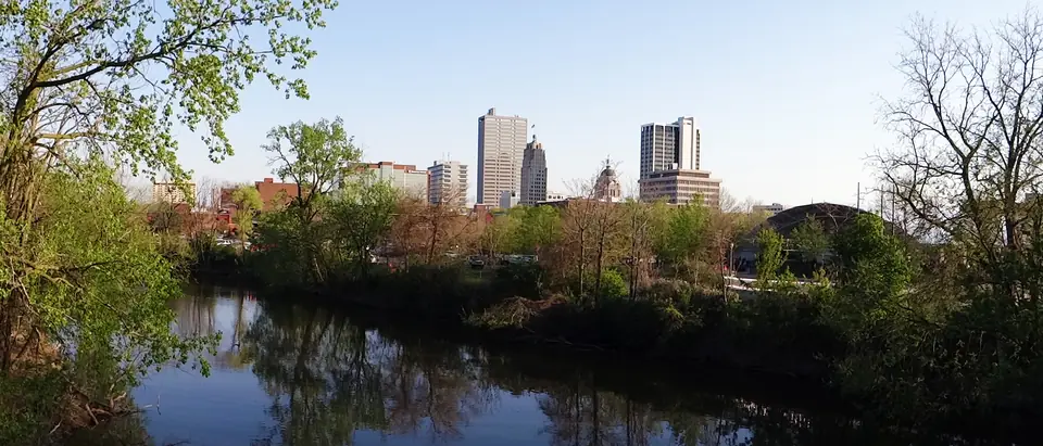Downtown Fort Wayne seen across the river from the trees