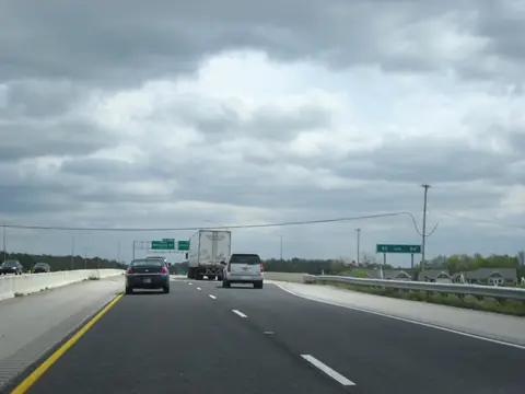 Traffic on I-469 near Fort Wayne under a cloudy sky