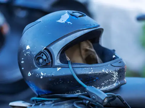 A scuffed motorcycle helmet